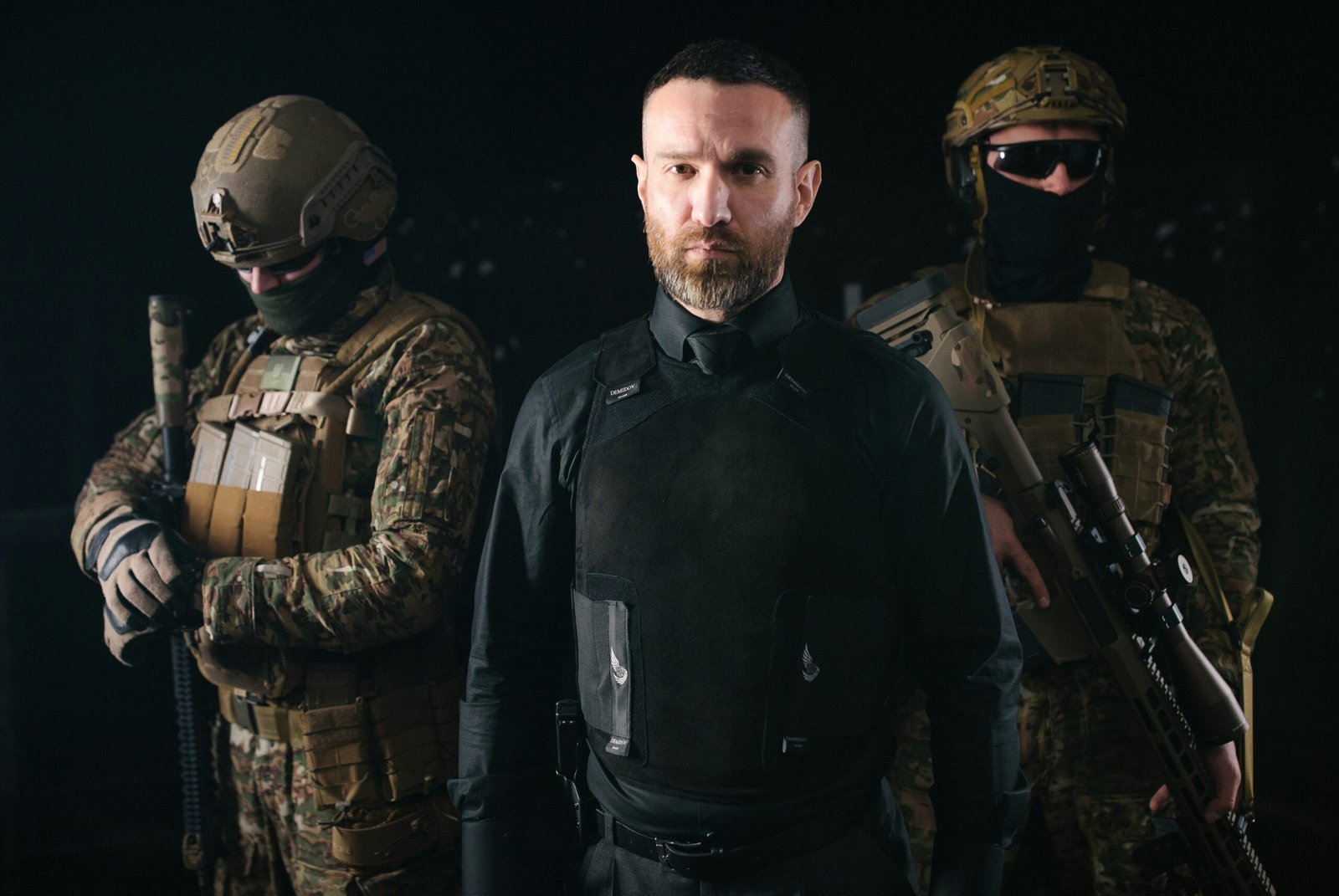 a group of men in military gear standing next to each other